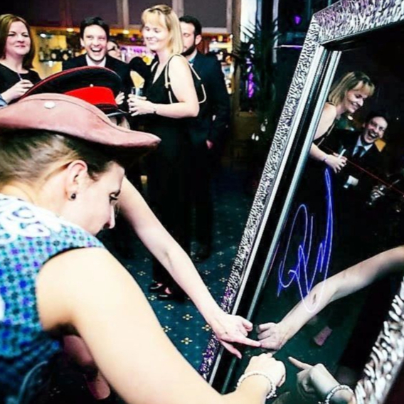 guest writing on mirror booth